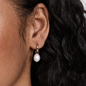 French retro gold hoop earrings with natural pearl drops for women shown on model