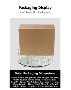 Detail view of a luxury gold mirrored tray with protective craft paper packaging box