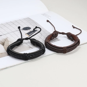 Men's minimalist braided leather bracelets in black and brown with adjustable cords
