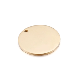 Close-up of a round gold pendant charm with a polished finish on a white background