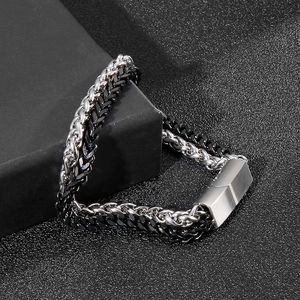Close-up of double-layer wheat chain punk bracelet for men in black and silver steel