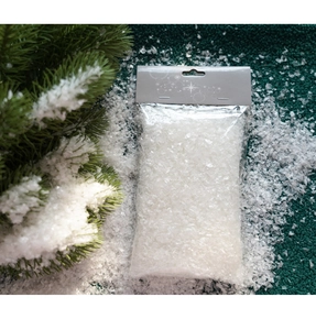 Detailed view of artificial white snow powder in clear packaging for Christmas decor