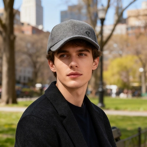 Men's winter baseball cap with ear flaps in grey wool texture and metal logo