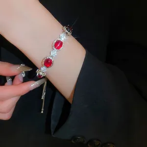 Elegant red gemstone flower bracelet with zircons and adjustable silver sliding clasp