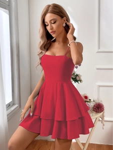 Detailed close-up of a red tiered cotton sundress with a square neck and thin straps