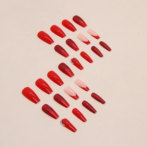 Sparkly red coffin press-on nails set with glitter, french tips and rhinestone accents