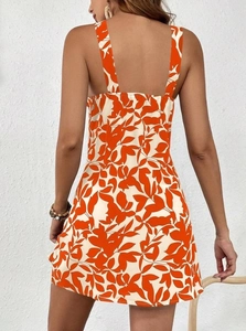 Detail of the open back design on an orange and white floral sleeveless summer dress