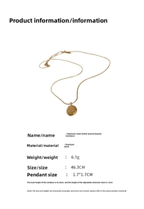 Detail showing the 46.3cm gold titanium steel necklace with a 1.7cm round letter pendant