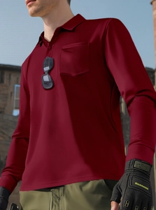 Detail of dark red long-sleeve polo shirt featuring a chest pocket and bird-eye breathable fabric