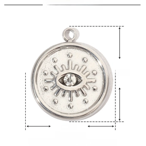 Macro detail of stainless steel evil eye charm with rhinestone and 13mm diameter scale