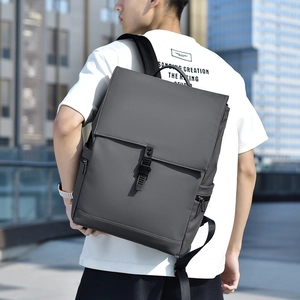 Men's dark gray minimalist backpack shown from a back-view perspective on a model