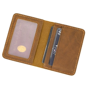 Macro view of vintage brown crazy horse leather wallet with card slots and ID window