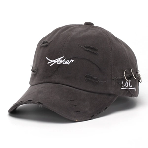 Detail of gray distressed baseball cap with Asher embroidery and silver metal rings