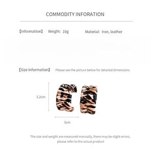 Detailed view of C-shaped leopard print leather earrings with specific size dimensions