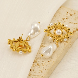 Vintage style gold Evil Eye pearl earrings with baroque drop pearls on silk fabric