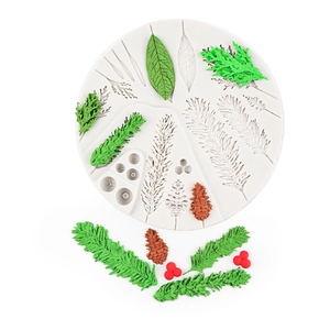 Christmas pine cone and leaf silicone cake mold with finished green leaves and red berries