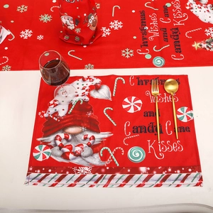 Festive red Christmas placemat set featuring cute gnomes, candy canes, and snowflakes patterns