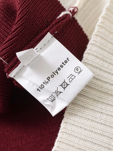 Detailed close-up showing the 100% Polyester material label and contrast knit texture