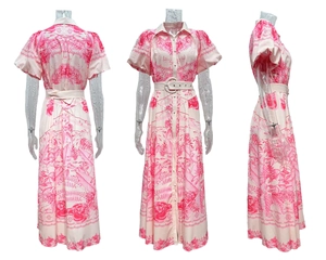 Detail view showing pink floral print, button front, and matching belt on high-waist dress