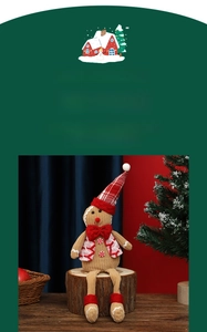 Detailed view of gingerbread man plush with red striped hat on rustic wood stand