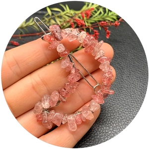Moon-shaped hair clip with natural pink strawberry crystals on silver metal base