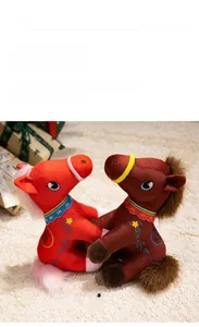 Detail of plush horse dolls with ethnic embroidery and colorful festive reins