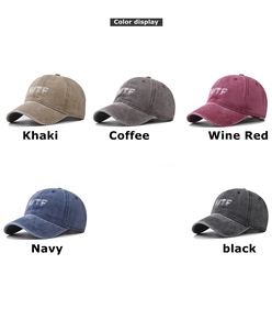 Color display of washed cotton baseball caps with WTF embroidery in five retro colors