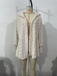 Detail of cream cable-knit hood and soft plush fabric texture on this thermal cardigan