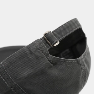 Detailed macro of washed cotton baseball cap with adjustable metal buckle and stitching