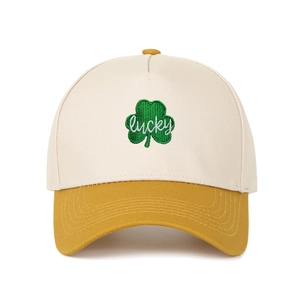 Detail of green clover embroidery and white Lucky script on a 5-panel trucker baseball cap