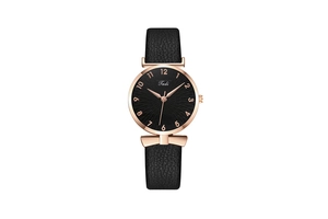 Detail of black quartz watch face with rose gold case and bow-tie leather strap lugs