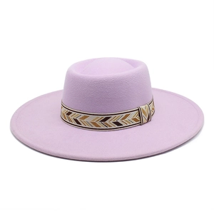 Close-up of light purple wool fedora hat featuring a bohemian woven herringbone band