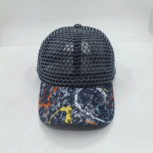 Detail of breathable black mesh baseball cap with vibrant graffiti print on the brim