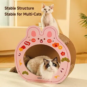 Pink cartoon rabbit-shaped cardboard cat scratching house with two cats inside