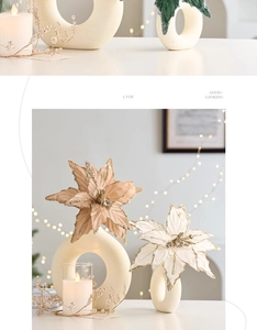 Close-up of champagne and ivory velvet Christmas flowers with glitter edges in Nordic decor