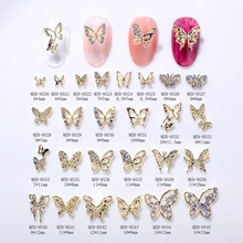 Macro view of mini metal butterfly nail charms with micro rhinestones and dimensions