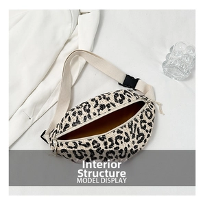 Internal structure of leopard woven waist bag with yellow lining and zipper closure