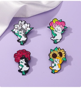 Detailed set of four cute enamel cat pins holding lilies, tulips, roses, and sunflowers