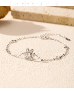 Detailed macro view of a s925 silver flower bracelet featuring sparkling zircon accents