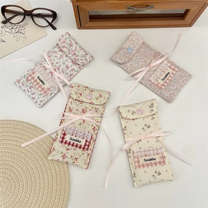 Floral fabric eyewear pouches set featuring lace details and ribbon bows for storage