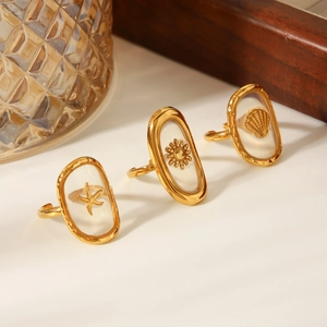 Gold stainless steel open rings featuring shell, starfish and sun motifs in resin