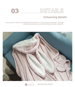 Detail of pink plush rabbit ear hood and soft white fleece lining on a cozy cape