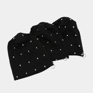 Three black knitted beanies with skull, rivet, pearl studs and metal ring accents