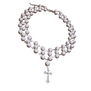 Double-layer pearl necklace with a gothic zircon cross pendant on a white background