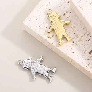 Hip hop style gold and silver boy character pendants on textured stone background