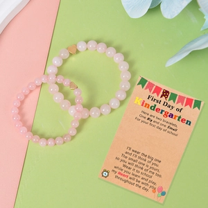Pink crystal bead bracelets with heart pendants on a Back to School gift card