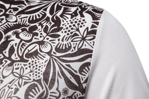 Detailed close-up of high-quality knit fabric featuring black and white floral prints