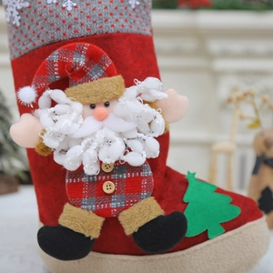 Red Christmas stocking with 3D Santa Claus and gray knit cuff for holiday decoration