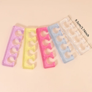 Five glittery silicone toe separators for nail polish in purple yellow pink and blue