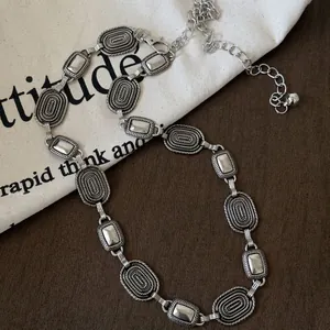 Vintage silver metal butterfly heart waist chain belt with textured oval links